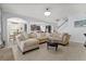 Open-concept living area featuring neutral tones and seamless flow to the kitchen and dining at 2344 Kelbrook Ct, Oviedo, FL 32765