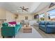 Bright living room with hardwood floors, comfortable seating, and natural light from the windows at 2344 Kelbrook Ct, Oviedo, FL 32765