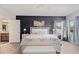 Primary bedroom featuring modern decor, large windows and wood-look flooring at 2344 Kelbrook Ct, Oviedo, FL 32765