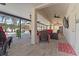 Covered poolside patio with comfortable seating and dining areas, ideal for relaxation and entertaining at 2344 Kelbrook Ct, Oviedo, FL 32765