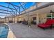 Expansive poolside patio with ample space for outdoor dining, lounging, and enjoying the Florida sunshine at 2344 Kelbrook Ct, Oviedo, FL 32765