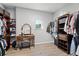 Walk-in closet featuring wood shelving and drawers for storage at 2344 Kelbrook Ct, Oviedo, FL 32765