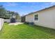 The grassy backyard includes a shed and a small patio at 2393 Oxmoor Dr, Deland, FL 32724