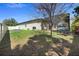Spacious backyard featuring a screened-in pool area and well-maintained lawn perfect for outdoor activities at 2393 Oxmoor Dr, Deland, FL 32724
