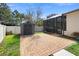Backyard with a shed, small patio, green grass, and a white fence at 2393 Oxmoor Dr, Deland, FL 32724