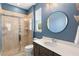 Modern bathroom featuring a glass-enclosed shower, large vanity, and stylish fixtures at 2393 Oxmoor Dr, Deland, FL 32724