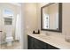 Contemporary bathroom with sleek vanity, framed mirror, and shower/tub combination at 2393 Oxmoor Dr, Deland, FL 32724