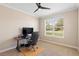 Neutral bedroom featuring an office setup and a ceiling fan at 2393 Oxmoor Dr, Deland, FL 32724