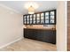 Elegant dining room featuring wood floors and custom cabinets with glass display cases at 2393 Oxmoor Dr, Deland, FL 32724