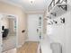 Bright entryway with coat rack and bench at 2393 Oxmoor Dr, Deland, FL 32724