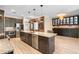 Spacious kitchen with stainless steel appliances, granite counters, and a large island with pendant lighting at 2393 Oxmoor Dr, Deland, FL 32724