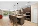 Modern kitchen featuring a center island with seating and stainless steel appliances at 2393 Oxmoor Dr, Deland, FL 32724
