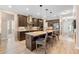 Spacious kitchen island with seating, pendant lights, and modern appliances at 2393 Oxmoor Dr, Deland, FL 32724