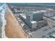 A high angle of the oceanfront hotel with the beach, city, and ample parking visible at 2700 N Atlantic Ave # 454, Daytona Beach, FL 32118