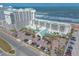 Scenic aerial shot of a beachfront resort with palm trees and parking at 2700 N Atlantic Ave # 454, Daytona Beach, FL 32118