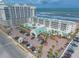Aerial view of a beachside resort with palm trees and parking at 2700 N Atlantic Ave # 454, Daytona Beach, FL 32118