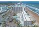 An aerial of the resort shows its proximity to the beach, pool, and the surrounding city at 2700 N Atlantic Ave # 454, Daytona Beach, FL 32118