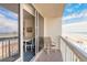 Balcony with ocean view, seating area, and access to the living room at 2700 N Atlantic Ave # 454, Daytona Beach, FL 32118