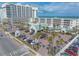Coastal resort featuring large buildings, palm trees, and a parking lot near the beach at 2700 N Atlantic Ave # 454, Daytona Beach, FL 32118