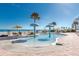 Shallow kiddie pool with mushroom-shaped water features, surrounded by lounge chairs and umbrellas at 2700 N Atlantic Ave # 454, Daytona Beach, FL 32118