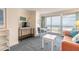 Inviting living room with ocean view, entertainment center, and a dining table at 2700 N Atlantic Ave # 454, Daytona Beach, FL 32118