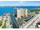 An aerial view shows the building, parking, waterway, landscaping, and surrounding area at 2801 S Ridgewood Ave # 1214, South Daytona, FL 32119