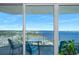 Balcony view showcasing seating, table, and expansive views of bay and city skyline beyond at 2801 S Ridgewood Ave # 1214, South Daytona, FL 32119