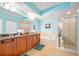 Bathroom offers dual sink vanity, soaking tub, and glass-enclosed shower at 2801 S Ridgewood Ave # 1214, South Daytona, FL 32119