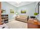 Light-filled bedroom with neutral walls, wood floors, and comfortable furniture at 2801 S Ridgewood Ave # 1214, South Daytona, FL 32119