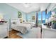 Inviting bedroom showcasing two twin beds, water views, and light blue walls and contemporary decor at 2801 S Ridgewood Ave # 1214, South Daytona, FL 32119