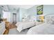 Inviting bedroom showcasing two twin beds, and light blue walls and contemporary decor at 2801 S Ridgewood Ave # 1214, South Daytona, FL 32119