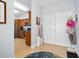 Foyer with tiled floors and a view of kitchen with stainless steel appliances at 2801 S Ridgewood Ave # 1214, South Daytona, FL 32119