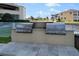 Outdoor grill station with stainless steel grills and granite countertops at 2801 S Ridgewood Ave # 1214, South Daytona, FL 32119