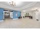 Hallway showing tile flooring, seating, décor, fire equipment, and exit signs at 2801 S Ridgewood Ave # 1214, South Daytona, FL 32119