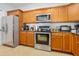 Kitchen boasts stainless appliances, granite counters, and stylish wood cabinetry at 2801 S Ridgewood Ave # 1214, South Daytona, FL 32119