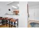 Breakfast bar separates the kitchenette from the front entryway with hat rack at 2801 S Ridgewood Ave # 1214, South Daytona, FL 32119