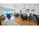 Bright living area with balcony access, ceiling fan, and comfortable furnishings at 2801 S Ridgewood Ave # 1214, South Daytona, FL 32119