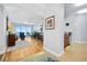 Open-concept living room and dining area with hardwood floors and sliding glass doors to balcony at 2801 S Ridgewood Ave # 1214, South Daytona, FL 32119