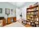 Cozy office with built-in bookcase, desk, and ample natural light at 2801 S Ridgewood Ave # 1214, South Daytona, FL 32119