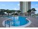Community pool with waterfront views surrounded by manicured landscaping at 2801 S Ridgewood Ave # 1214, South Daytona, FL 32119