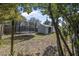 Large backyard featuring a trampoline and storage shed, offering ample space for recreational activities at 2821 Oak Lea Dr, South Daytona, FL 32119