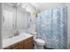 Bathroom features a shower with a curtain and a vanity with a sink at 2821 Oak Lea Dr, South Daytona, FL 32119