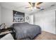 This bedroom has a ceiling fan and a large closet with white doors at 2821 Oak Lea Dr, South Daytona, FL 32119