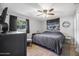 Neutral bedroom with a ceiling fan and a window view at 2821 Oak Lea Dr, South Daytona, FL 32119