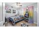This bedroom has a ceiling fan and a window view at 2821 Oak Lea Dr, South Daytona, FL 32119