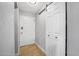 Hallway with tile flooring, a closet, and a white front door at 2821 Oak Lea Dr, South Daytona, FL 32119