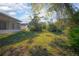 A view of the lush backyard at 2841 Idleweise Dr, Deltona, FL 32738