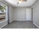 Modern bedroom with hardwood floors, ceiling fan, and large window at 2841 Idleweise Dr, Deltona, FL 32738