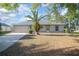 Delightful single-Gathering home with a spacious front yard and a two-car garage at 2841 Idleweise Dr, Deltona, FL 32738