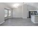 Bright, open living room featuring hardwood floors, plenty of natural light, and contemporary fixtures at 2841 Idleweise Dr, Deltona, FL 32738